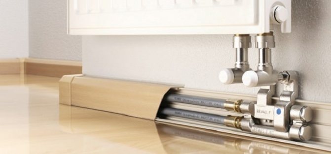 Comment cacher les colonnes montantes de chauffage dans un appartement
