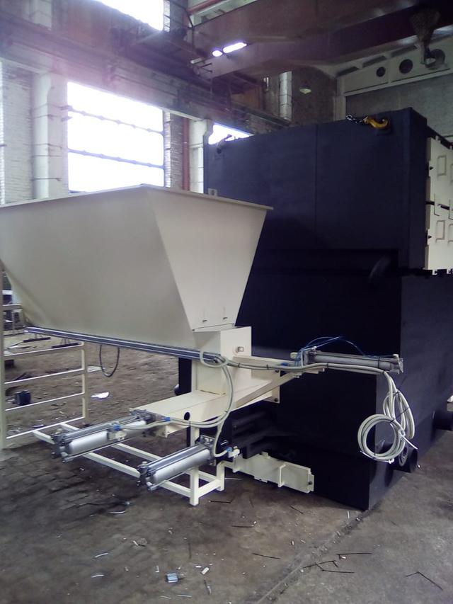 Alimentation de sciure automatique