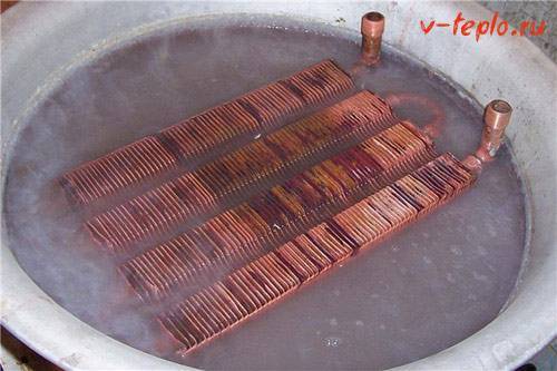 Rinçage de l'échangeur de chaleur d'une chaudière à gaz avec de l'acide citrique